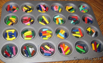 muffin tin of broken, peeled crayons