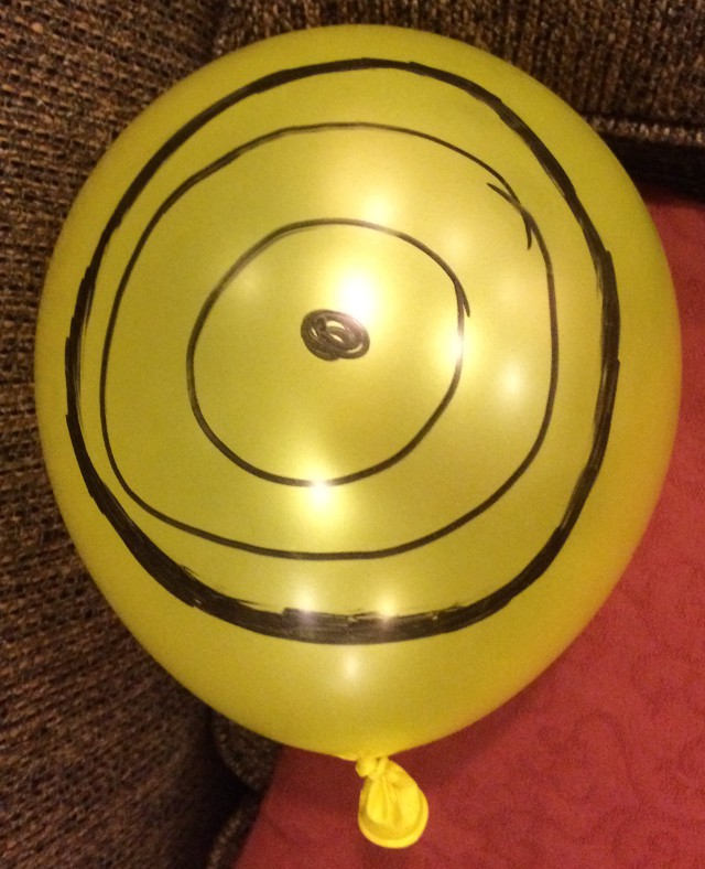 image of a face drawn on a balloon with marker