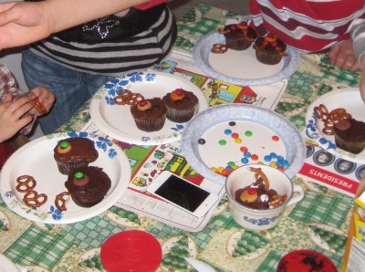 photo of children making cupcakes that look like reindeer