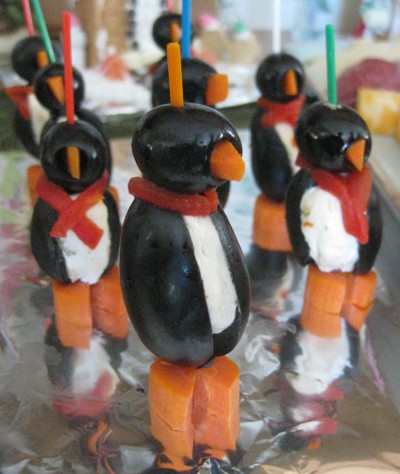 photo of appetizers that look like penguins but are mode from olives