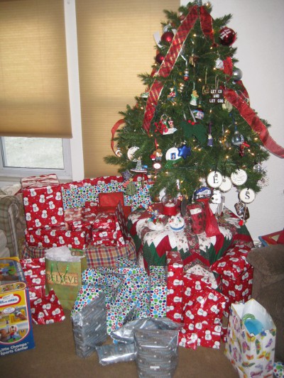 photo of presents and gifts under a Christmas tree