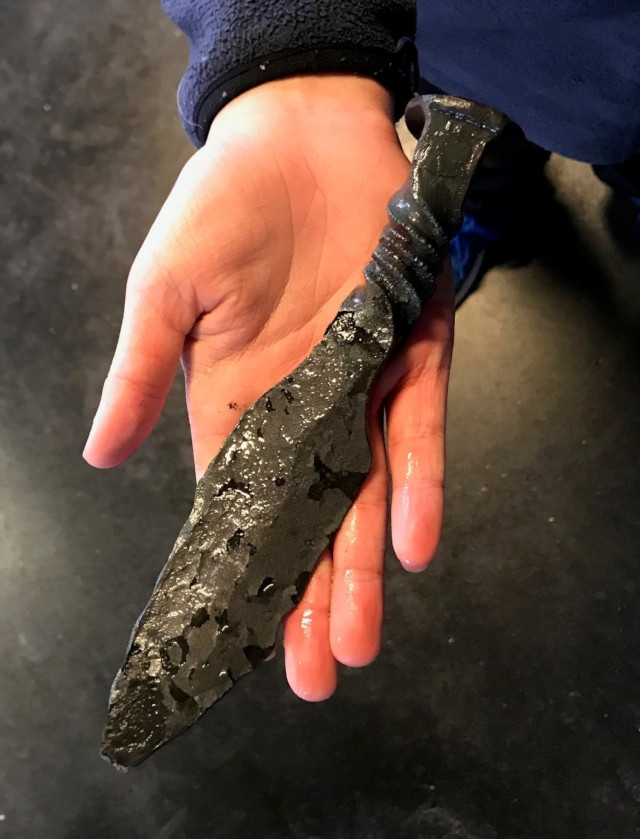 image of a dagger after hammering but before grinding and polishing