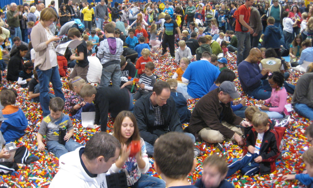 people playing in the big brick pile at the Lego Kids Fest