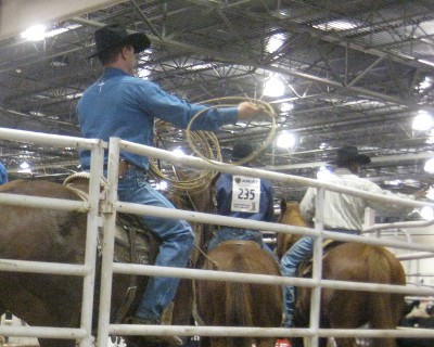 photo of rodeo cowboys practicing with the lasso