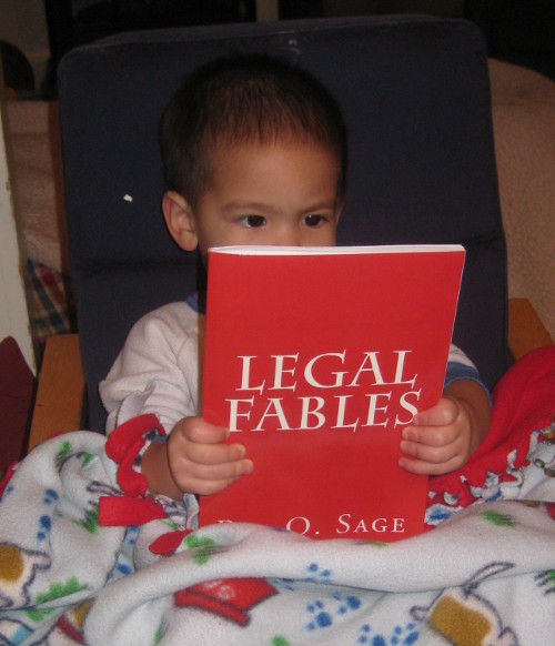 photo of a baby reading Legal Fables