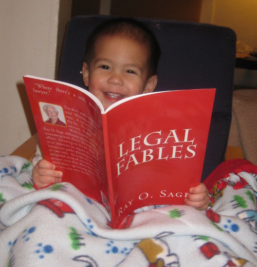 photo of a baby happily reading Legal Fables