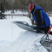 picture of sledding down a snow pile