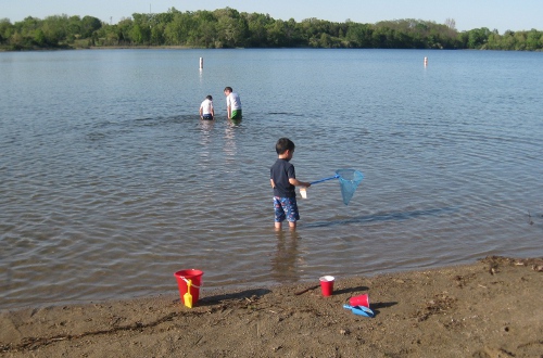 children playing in a lake