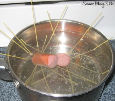 cooking pincushion hot dogs in boiling water