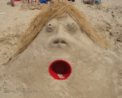 sand sculpture of a woman's head