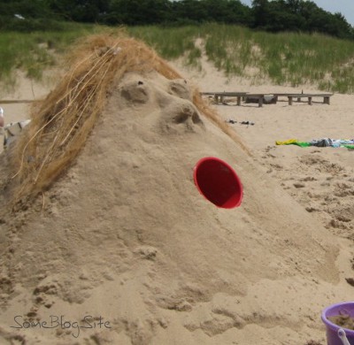 sand sculpture of a lady's head