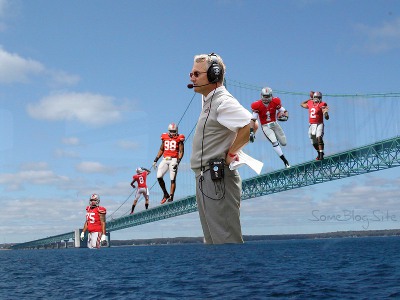 picture of a suspension bridge containing Jim Tressel and 5 Ohio State players who were suspended