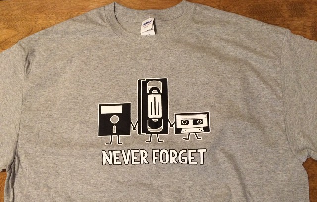 image of a T shirt with a floppy disk, video tape, and cassette tape