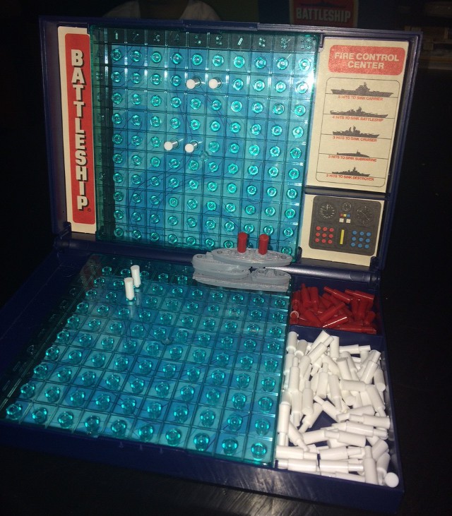 image of a Battleship game with the pieces stacked