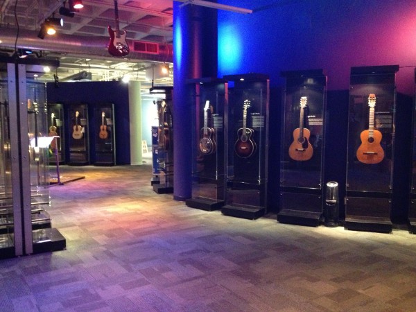 image of museum display of various guitars