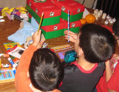 picture of children packing boxes for Operation Christmas Child