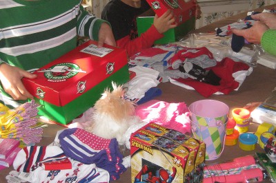 picture of children packing boxes for Operation Christmas Child