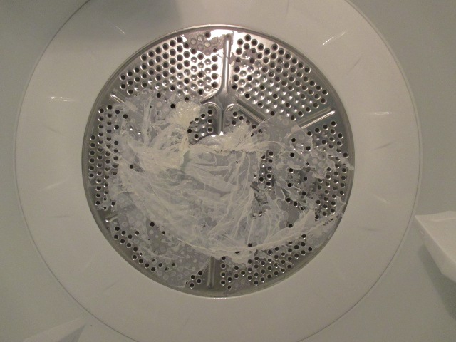 image of a clothes dryer with vinyl melted to the inside of the drum