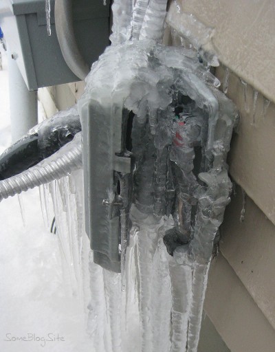 picture of a ice outside and inside a telephone box