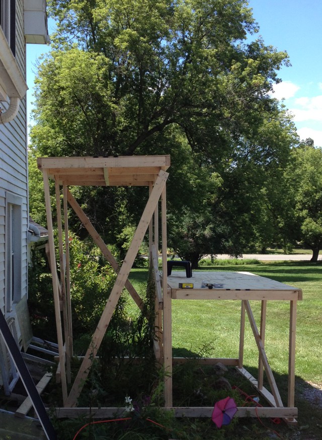 image of a makeshift scaffolding built out of 2x4s