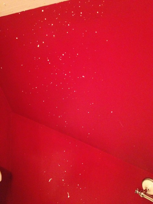 photo of shaving cream splattered on a red wall