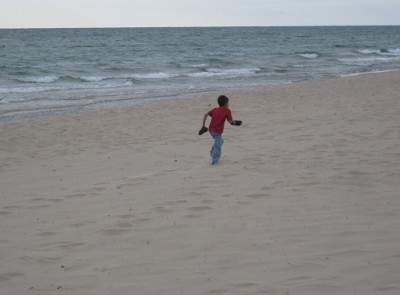 child running on a beach