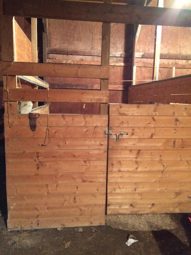 picture of the door of a horse stall in a barn