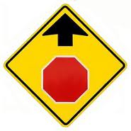 road sign showing a pictograph of stop sign ahead