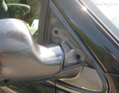 photo of the minivan side mirror with bolts removed