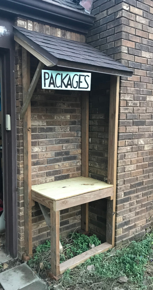 image of a shelter nook shelf with a roof built for delivery of packages boxes and bags