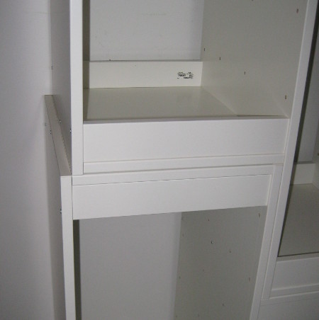 photo of TROFAST shelves stacked on each other with the edges misaligned