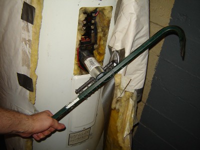 picture of a crowbar strapped to water heater element wrench for leverage