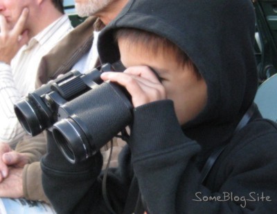 picture of child looking through binoculars