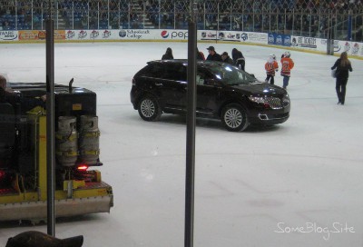 picture of a car driving on the hockey rink