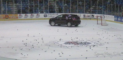 picture of a car driving on the hockey rink