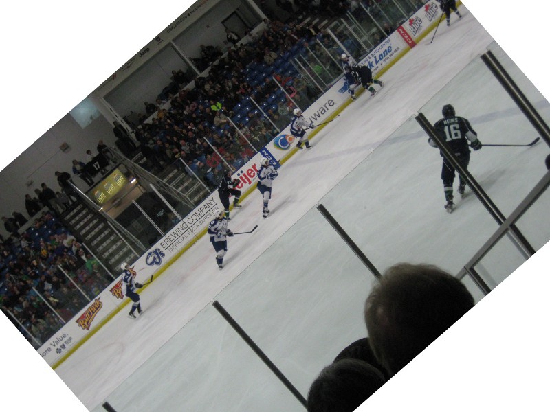 tilted picture of hockey players turning