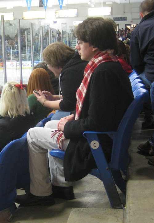 picture of someone dressed like Harry Potter at a hockey game