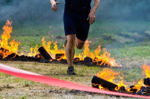 photo of the Warrior Roast fire obstacle in Warrior Dash, showing someone running through flames