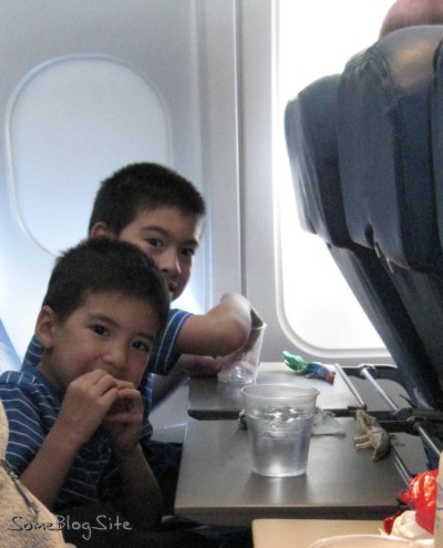 photo of our family enjoying snacks on the plane