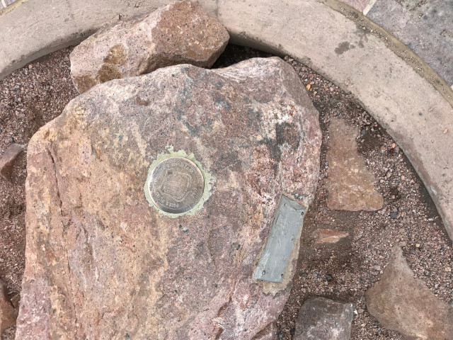 image of the surveyor's mark at Pike's Peak summit in Colorado Springs