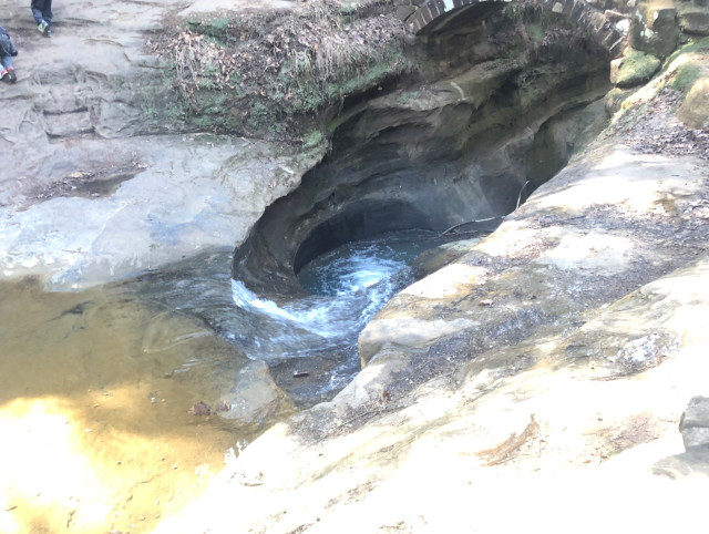 image of the devil's bathtub at Old Man Cave hiking area in Hocking Hills Ohio