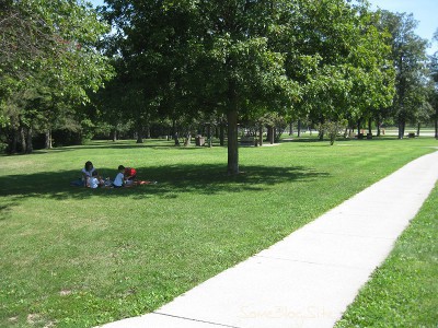 photo of people eating a picnic at a rest stop