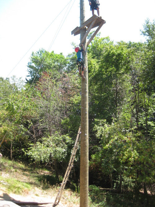 picture of a child climbing the tower to the zip line