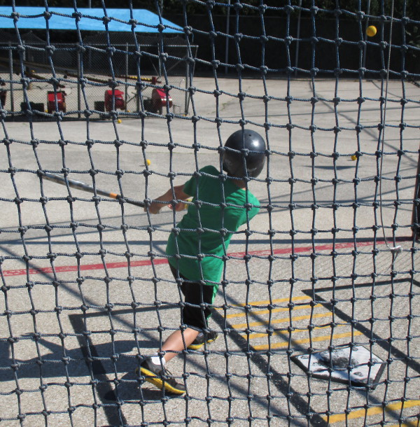 image of the children in the batting cages at Craig's Cruisers in Muskegon, MI