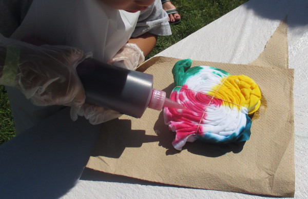 image of people making tie-dye shirts at Maranatha Bible and Missionary Conference in Norton Shores, MI