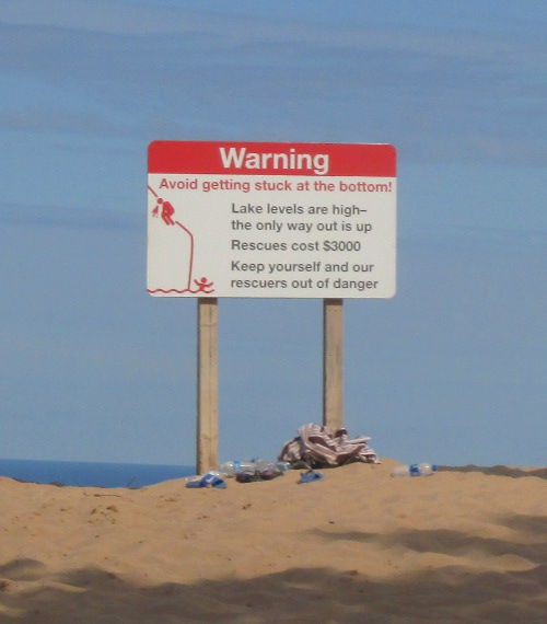 image of the warning sign at Sleeping Bear Dunes