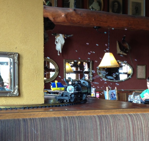photo of model train pulling a bubble blowing machine at the Buffalo Phil's restaurant in Wisconsin Dells