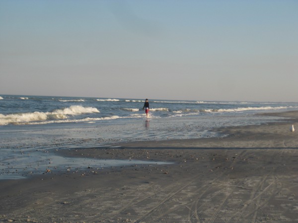 photo of someone walking down the beach in St. Augustine, FL