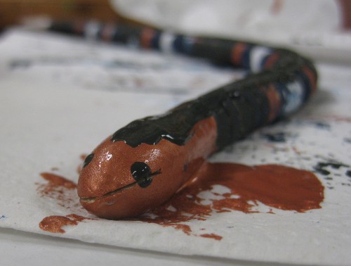 photo of a painted wooden snake