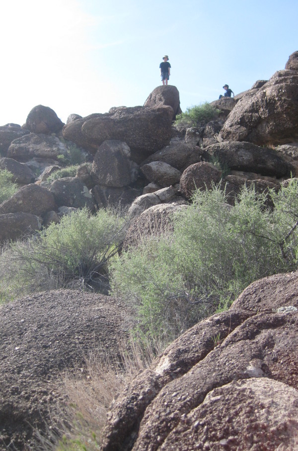 photo of children climbing rocks near Red Rock Canyon in Nevada